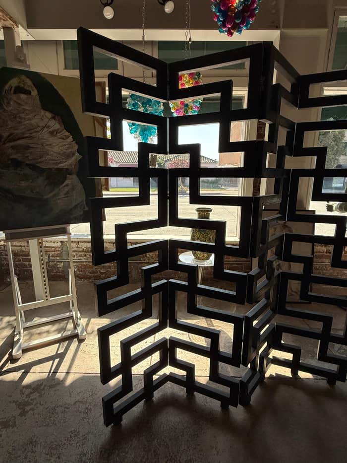 A black Cerused Oak Room Divider in the style of Eileen Gray