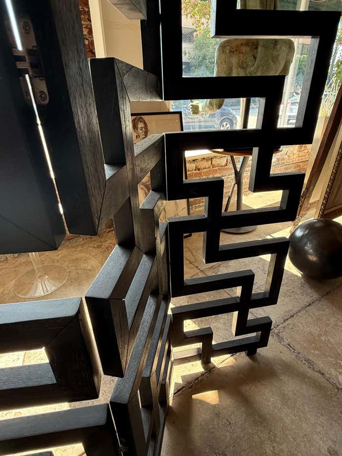 A black Cerused Oak Room Divider in the style of Eileen Gray