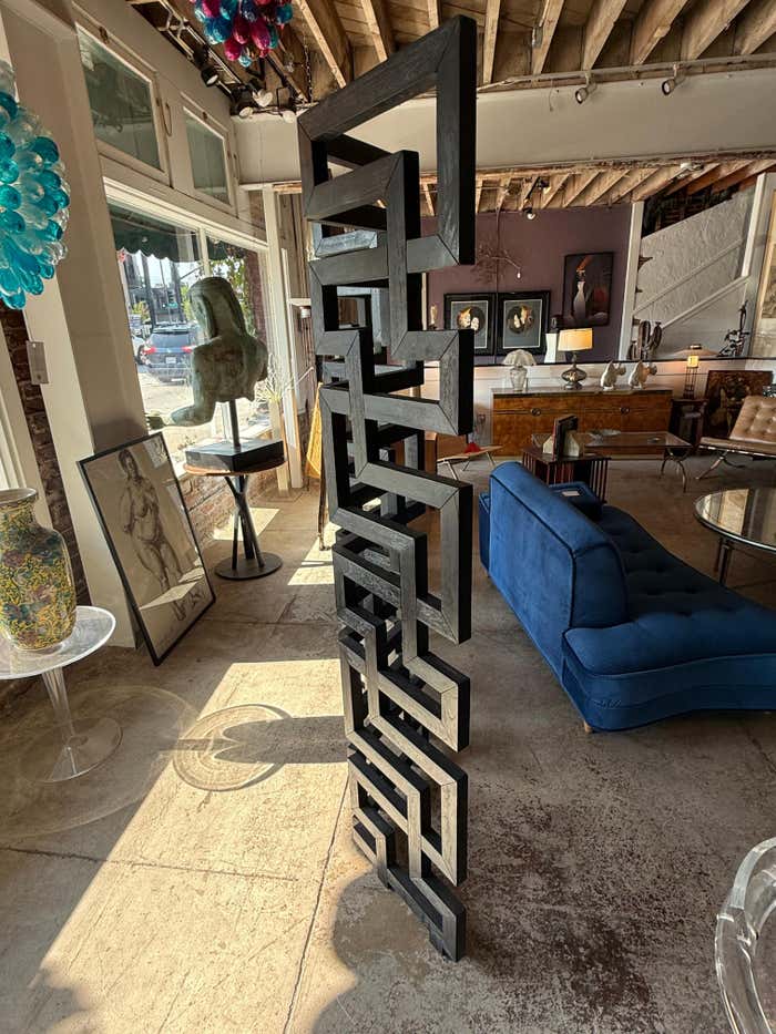 A black Cerused Oak Room Divider in the style of Eileen Gray