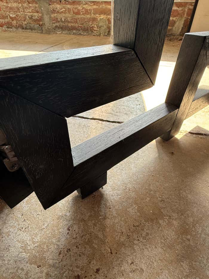 A black Cerused Oak Room Divider in the style of Eileen Gray