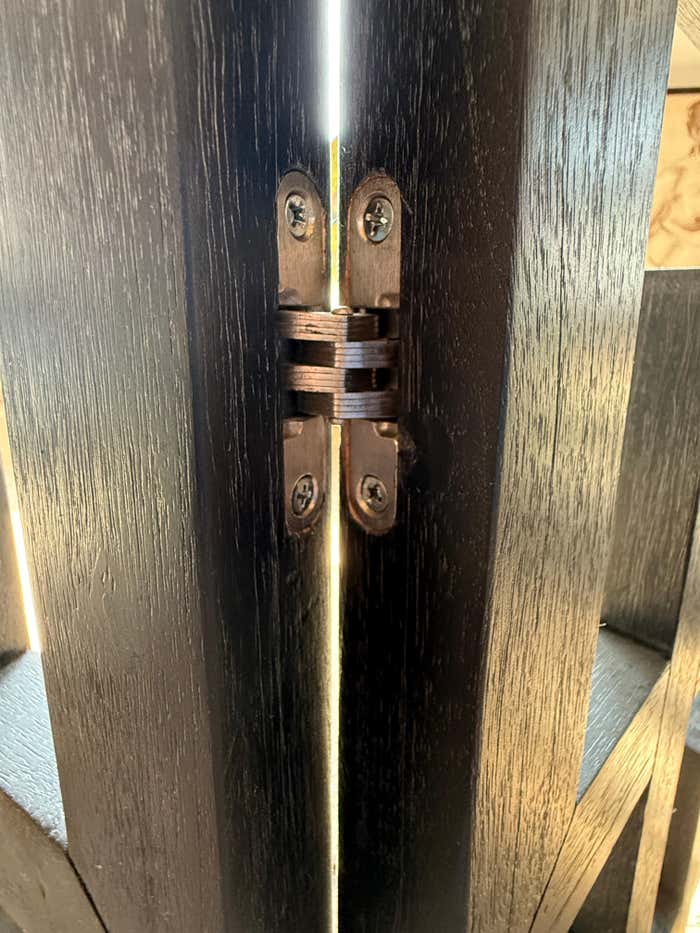 A black Cerused Oak Room Divider in the style of Eileen Gray