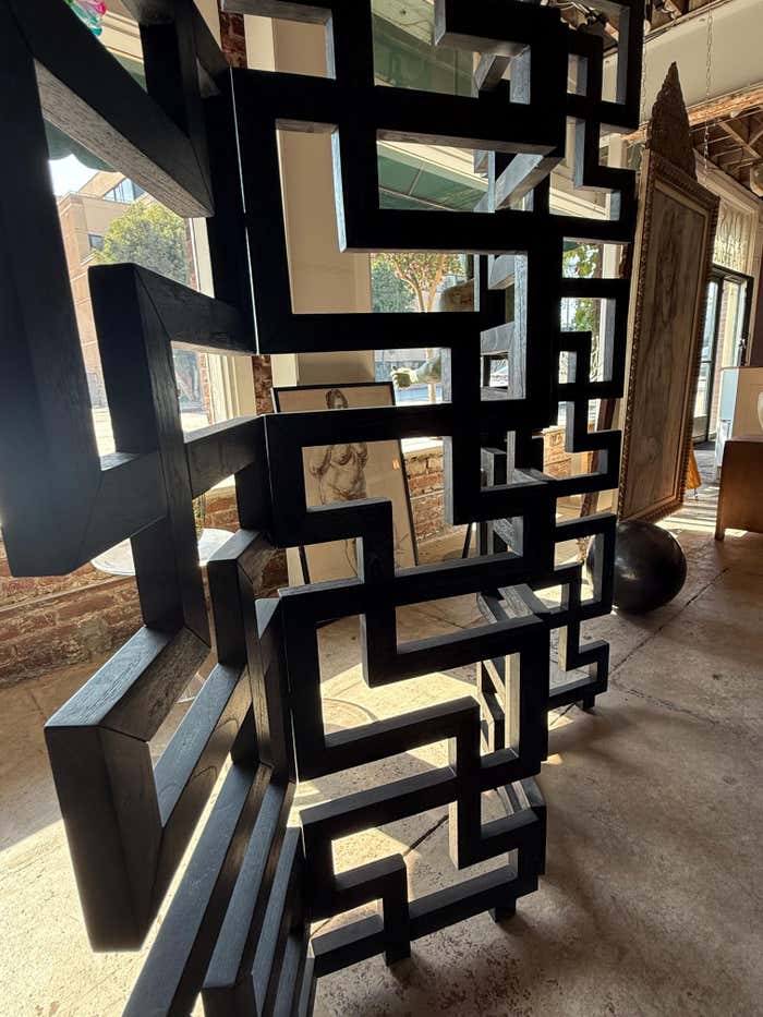A black Cerused Oak Room Divider in the style of Eileen Gray